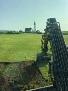 professional ground work being performed with an excavator in southern maine