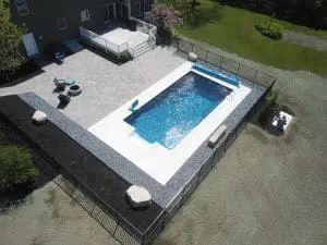 professional landscaping and hardscaping around a pool in southern maine