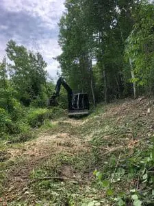 a seaside landscaping machine performing site work