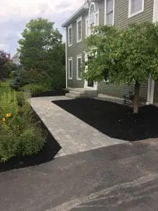 stone walkway leading to a home in southern Maine