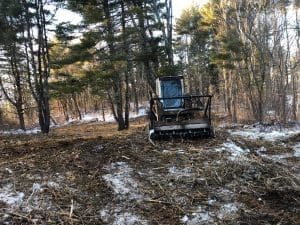 a seaside landscaping machine performing ground work